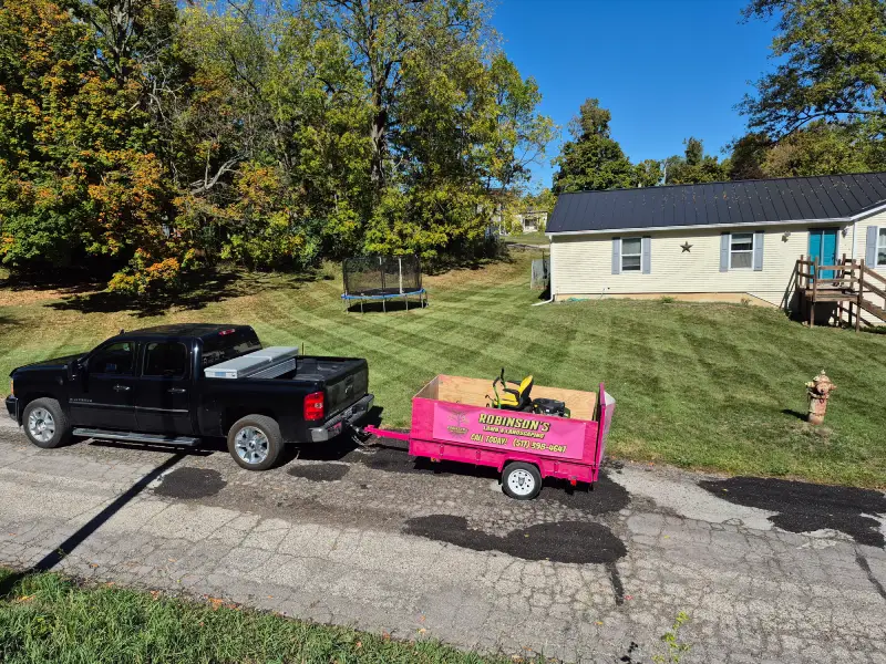 Stripes on a property with Truck in trailer in front